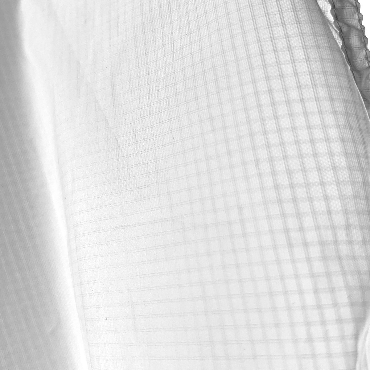 Close-up texture detail of the white ultralight ripstop nylon fabric used for the Double Rainbow tent condensation liner.